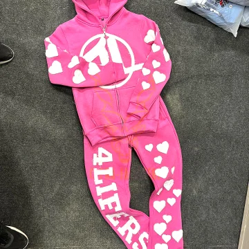 Custom vibrant pink full-zip hoodie and matching sweatpants set with white chest logo and raw-edge heart applique details