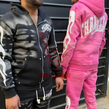 Custom washed fleece tracksuits with rhinestone hood accents, flame sleeve applique, and back puff print branding